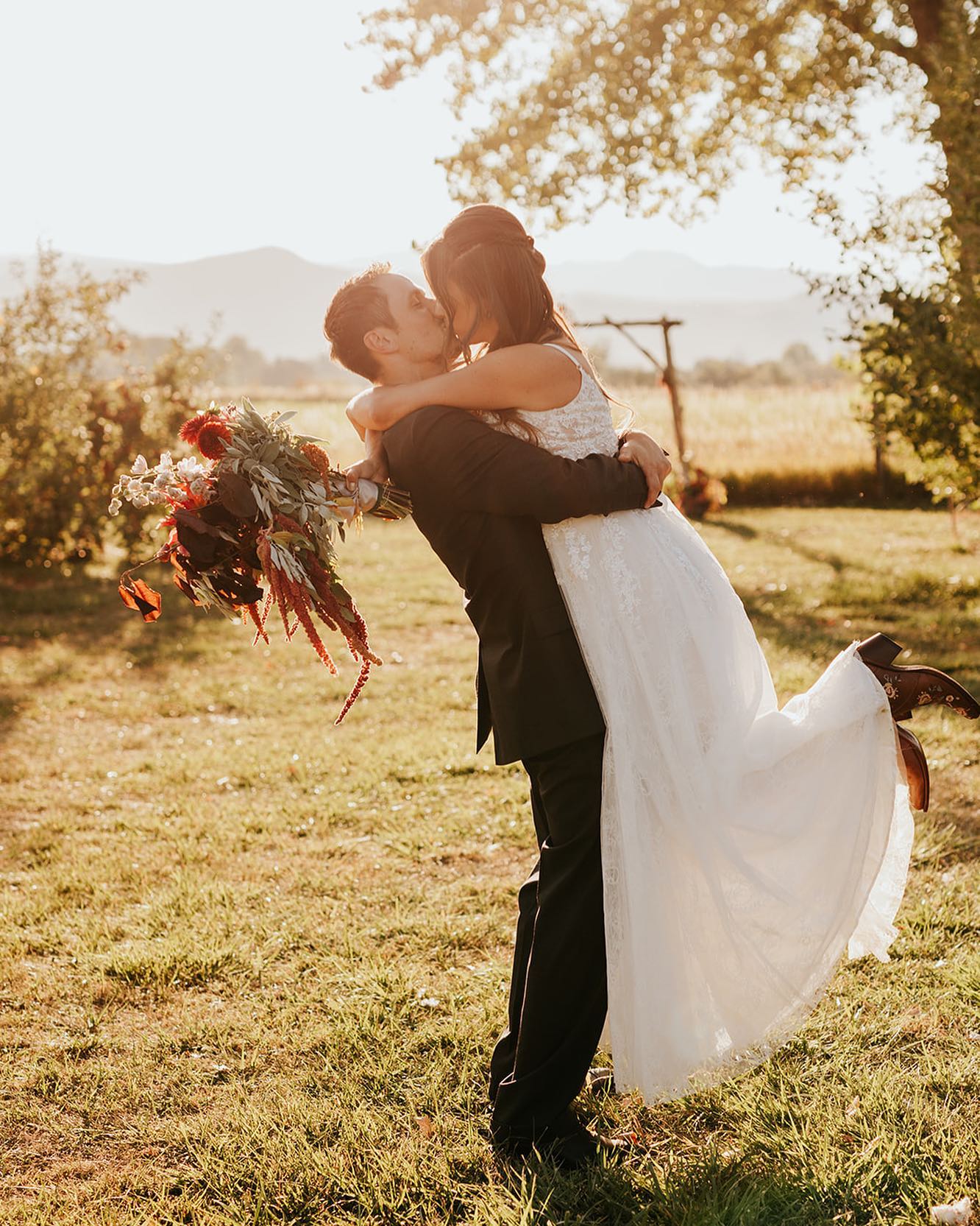 Helios Landscape Designer, Kristen whitehead and her late husband kissing on their wedding day.
